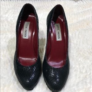 Black Steve Madden with snake skin-like design.